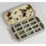 A Richard Wheatley aluminium 16-compartment fly-fishing tin with various flies