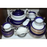 SECTION 20. A quantity of Aynsley dinner and tea wares in white with blue and gilded rims, including