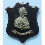 A 19th century cast bronze profile bust of The Duke of Wellington, mounted on ebonised wooden shield