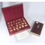 A collection of 25 'A Century of Empire' silver-gilt stamps, in fitted and lined box, together