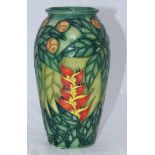 A boxed Moorcroft pottery vase in the 'Rainforest' pattern designed by Sally Tuffin, of ovoid