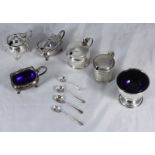 A small selection of assorted silver items including an open salt with blue glass liner by