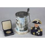 A commemorative figural pottery jug modelled as Admiral Lord Nelson and a Trafalgar beer stein,