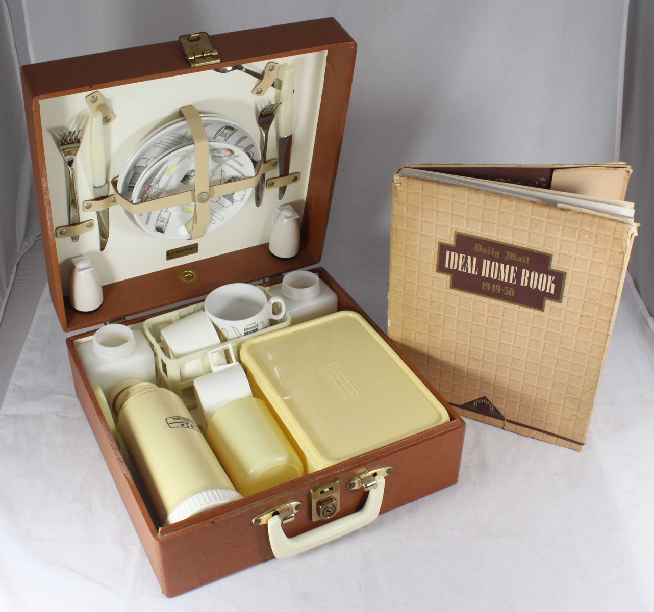 A Brexton picnic hamper containing two-each 'Fiesta' Barker Bros plates, cups and saucers,