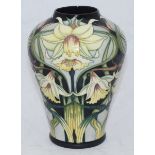 A boxed Moorcroft pottery vase in the 'Wordsworth' pattern designed by Rachel Bishop, signed, of