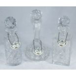 Three assorted glass decanters and stoppers, each with Staffordshire ceramic spirit labels, for