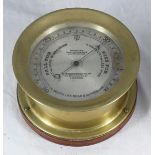 A brass-cased aneroid barometer by H. Hughes & Sons, Fenchurch St, London, 'Improved Marine