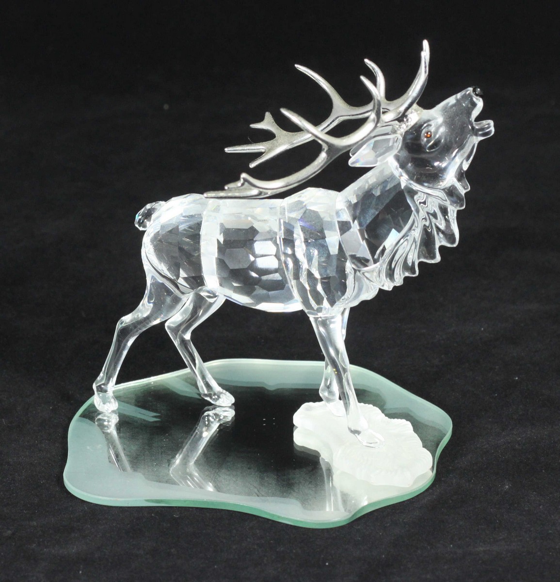 A Swarovski crystal model of a stag with silvered antlers, No. 291431, approx. 13cm high