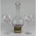 A Caithness glass pink-tinted and marbled shaft-and-globe decanter and stopper together with a