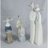 A Lladro figure group of two nuns, approx. 33cm high together with a Lladro figure group of