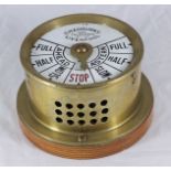 A Chadburn's Ships Telegraph, Liverpool, in circular brass case with white enamel dial on wooden