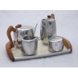 A five-piece Piquot Ware stainless steel, beechwood and formica tea set