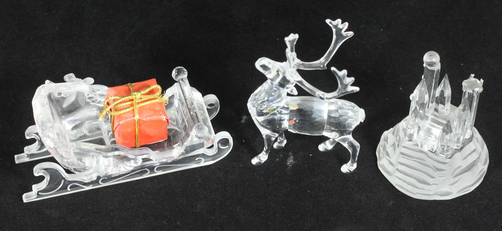 A Swarovski crystal model of a reindeer and sleigh with present, together with a Swarovski crystal - Image 2 of 2