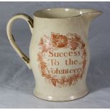 A late 18th century creamware pottery jug, one side with 'Success to the Volunteers' printed in red,