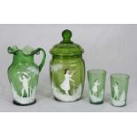 A Victorian Mary Gregory style green glass jug, a pair of beakers and a jar with cover.