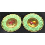 A pair of late 19th / early 20th century Coalport porcelain cabinet plates, the green