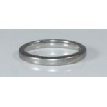 A plain platinum wedding band, 3.92 grams, size J/K