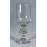 A late 18th/early 19th century English ale/wine glass, the bowl raised on a triple-knopped stem to