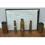 Six brass artillery shells including two engraved for Falklands and a glazed map of Stanley