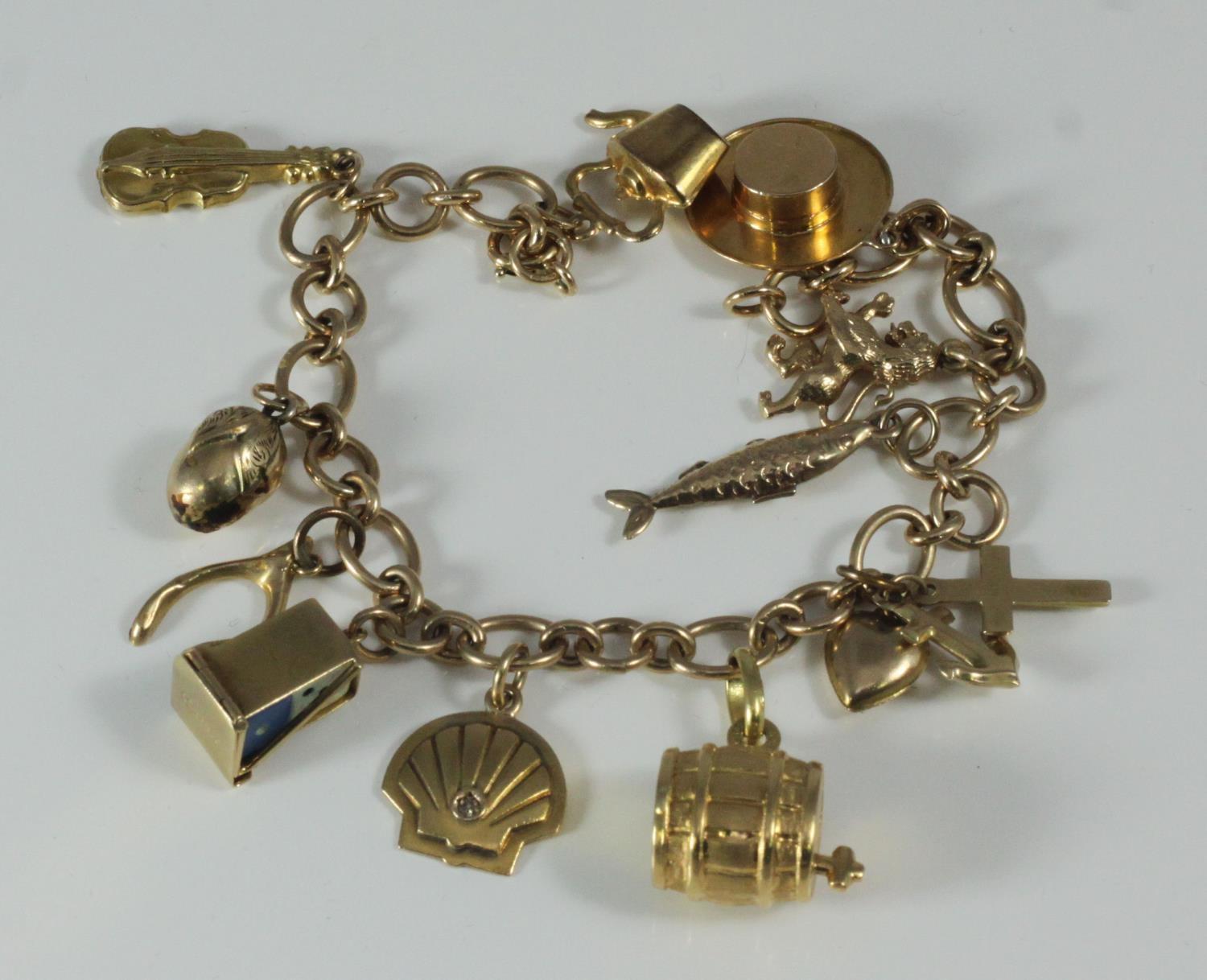 A ladies 9ct gold 13-charm bracelet, 22.18 grams