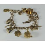 A ladies 9ct gold 13-charm bracelet, 22.18 grams