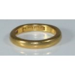 A 22ct gold plain wedding band, 7.29grams, size-M