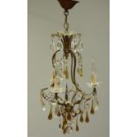 A Murano cut glass electrolier with clear and coloured glass drops, three sconces with simulated