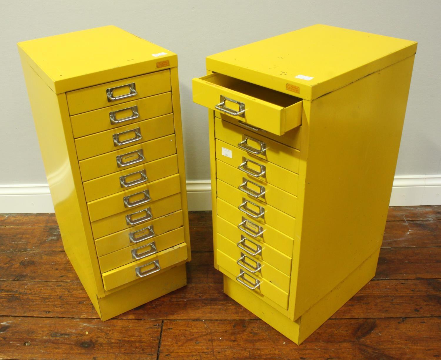 Two industrial style yellow metal ten-drawer filing cabinets, approx. 71cm high