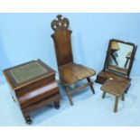 A low oak chair with pierced and scrolled back, together with a mahogany platform mirror, a walnut