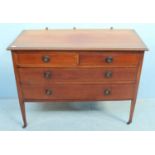 An Edwardian inlaid mahogany dressing table, with two short, over two long graduated drawers, raised