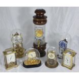 Four various anniversary clocks, two brass carriage clocks and a wine dispenser