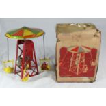 A mid-20th century plastic and tin-plate METTOY clockwork 'Chair-O-Plane', with original cardboard