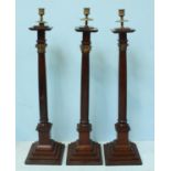 A set of three early 20th century Masonic oak candlesticks, the three columns comprising Ionic,