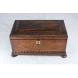 A 19th century rosewood tea caddy, of rectangular sarcophagus form with two lidded caddies and cut-