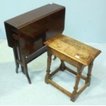A reproduction antique style oak joint stool, together with a stained walnut Sutherland table