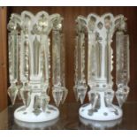 A pair of 19th century Bohemian overlay white opaque glass and clear cut glass lustre vases with