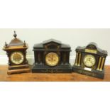 A Victorian black slate clock of classical temple form together with a similar ebonised wooden