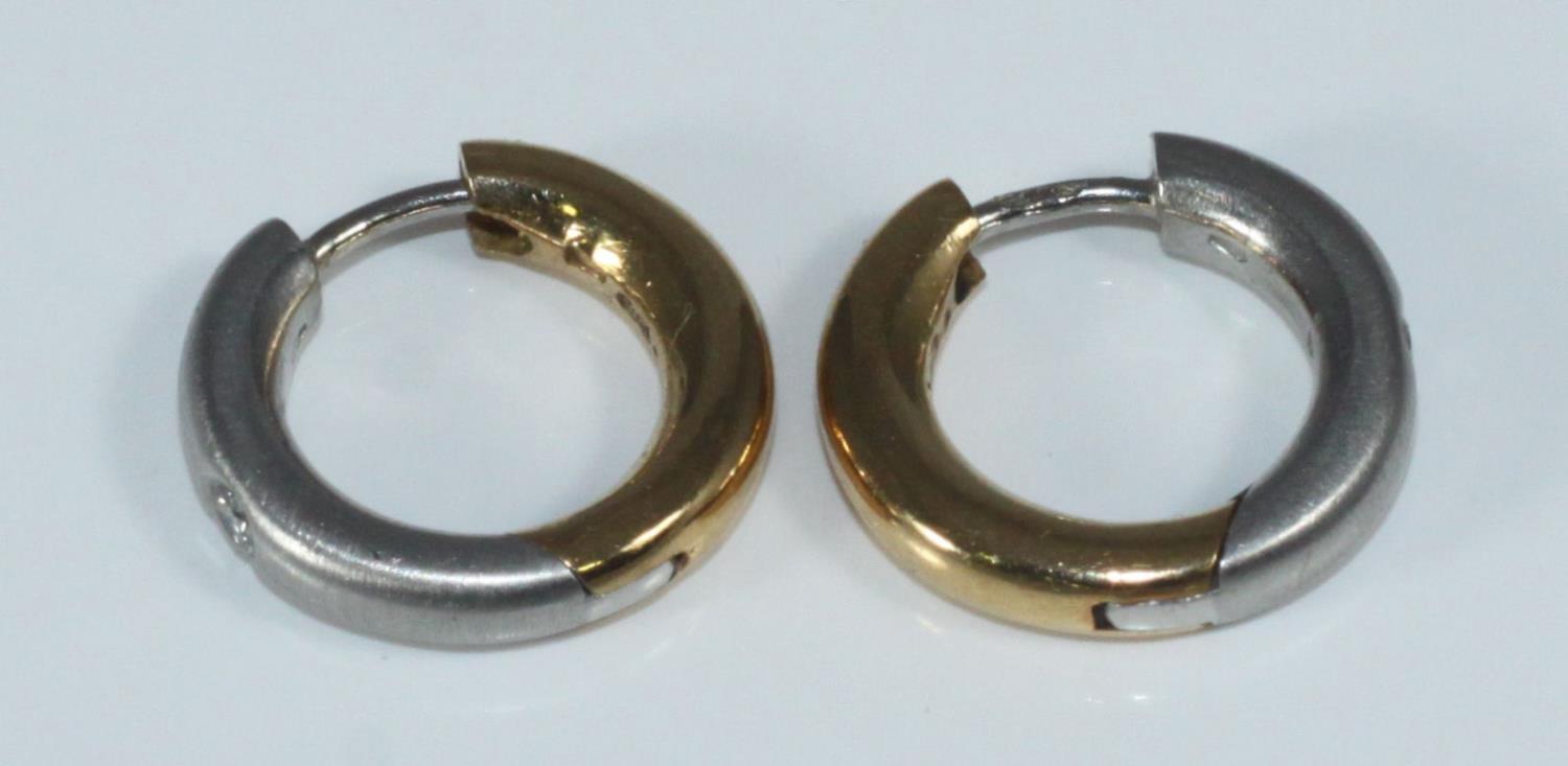 A pair of Platinum, diamond and 18ct yellow gold hoop earrings by Andre Bogaert, each set with a