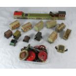 A German lithographed tinplate clockwork toy train and single carriage with goods shed and