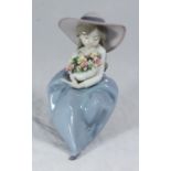 A boxed Lladro porcelain figurine 'Fragrant Bouquet'/'Que Bonita Es La Primavera' '5862'. 20cm tall