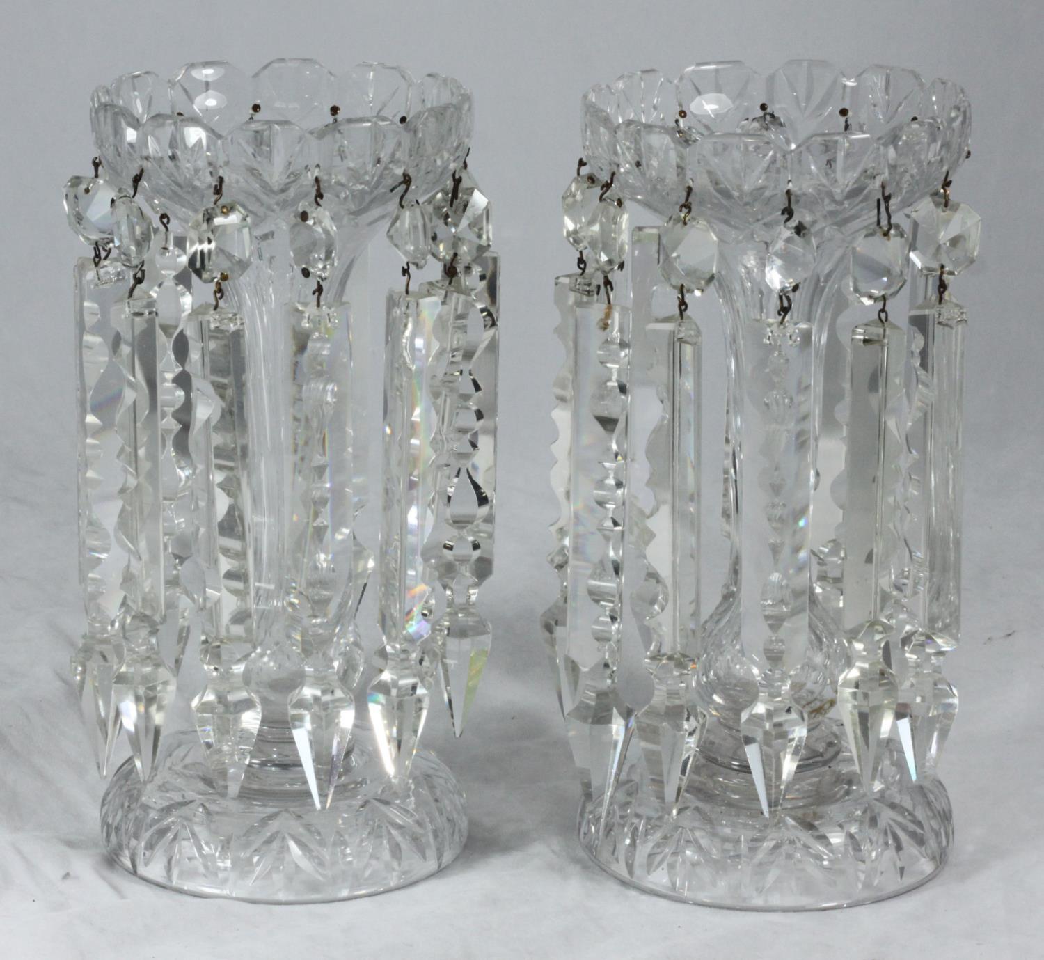 A pair of clear cut glass lustres, one drop as found and one missing, approx. 25cm high, together