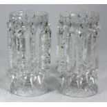 A pair of clear cut glass lustres, one drop as found and one missing, approx. 25cm high, together