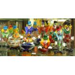 A collection of seven assorted Murano glass figures modelled as clowns, together with three Murano