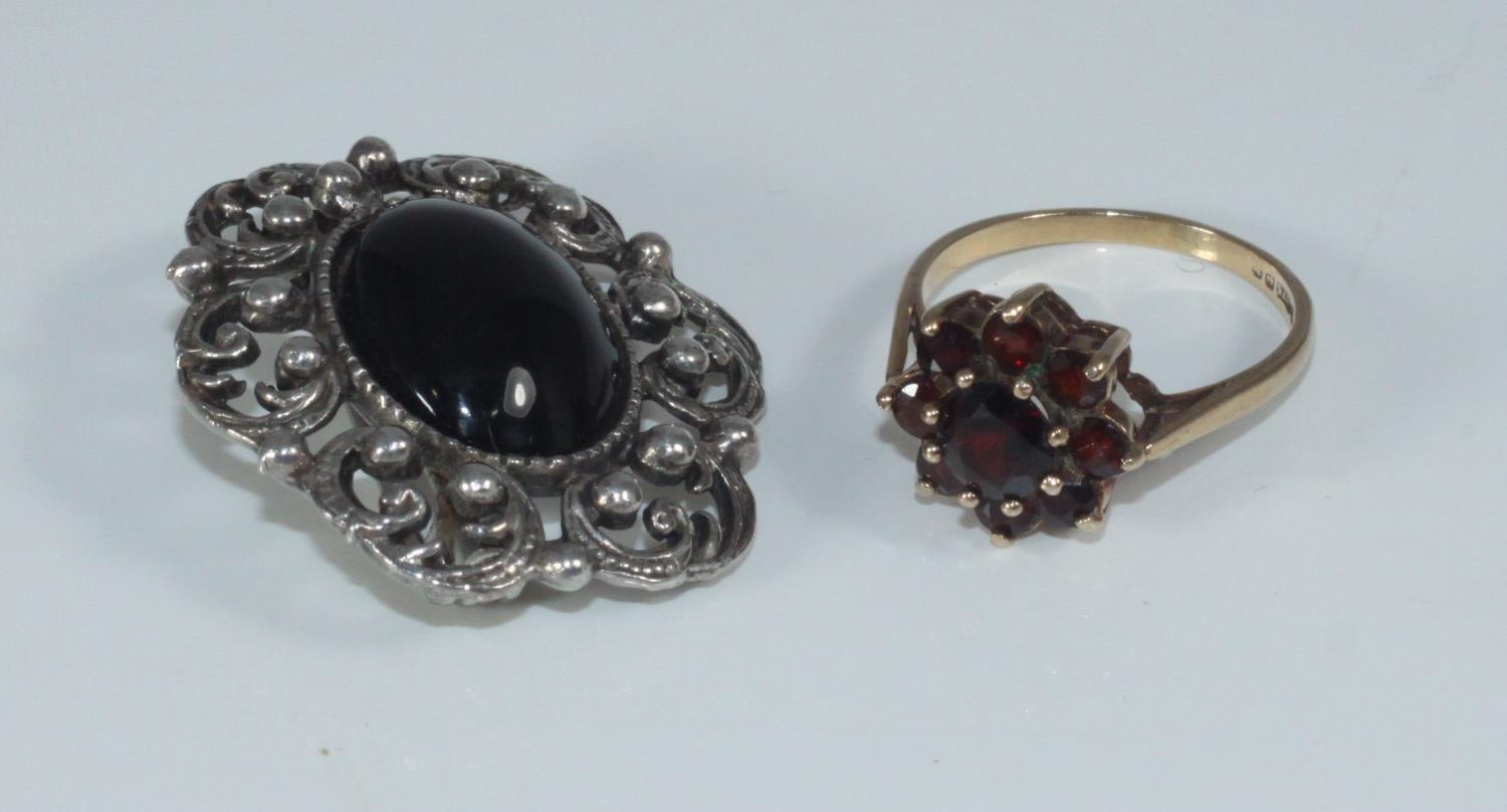 A 9ct gold and garnet tiered-cluster ring together with a costume jewellery brooch - Image 2 of 2