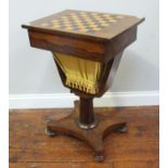 A 19th century rosewood games table/work table, with chess board top, a single frieze drawer with