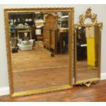 A large rectangular gilt-framed wall mirror with bevelled glass, 99x127cm, together with a