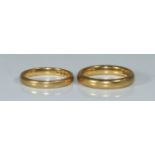 Two 22ct gold wedding bands, size M and size J, 9.82 grams