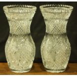 A pair of good quality, heavy, cut glass vases, possibly Waterford, of oval form with flared necks