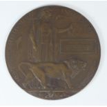 A bronze WWI memorial plaque (death penny) engraved to Peter Fuller