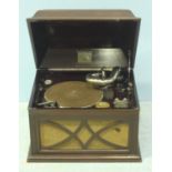 An HMV wind-up table gramophone in mahogany case, complete with handle and spare needles, 47cm wide